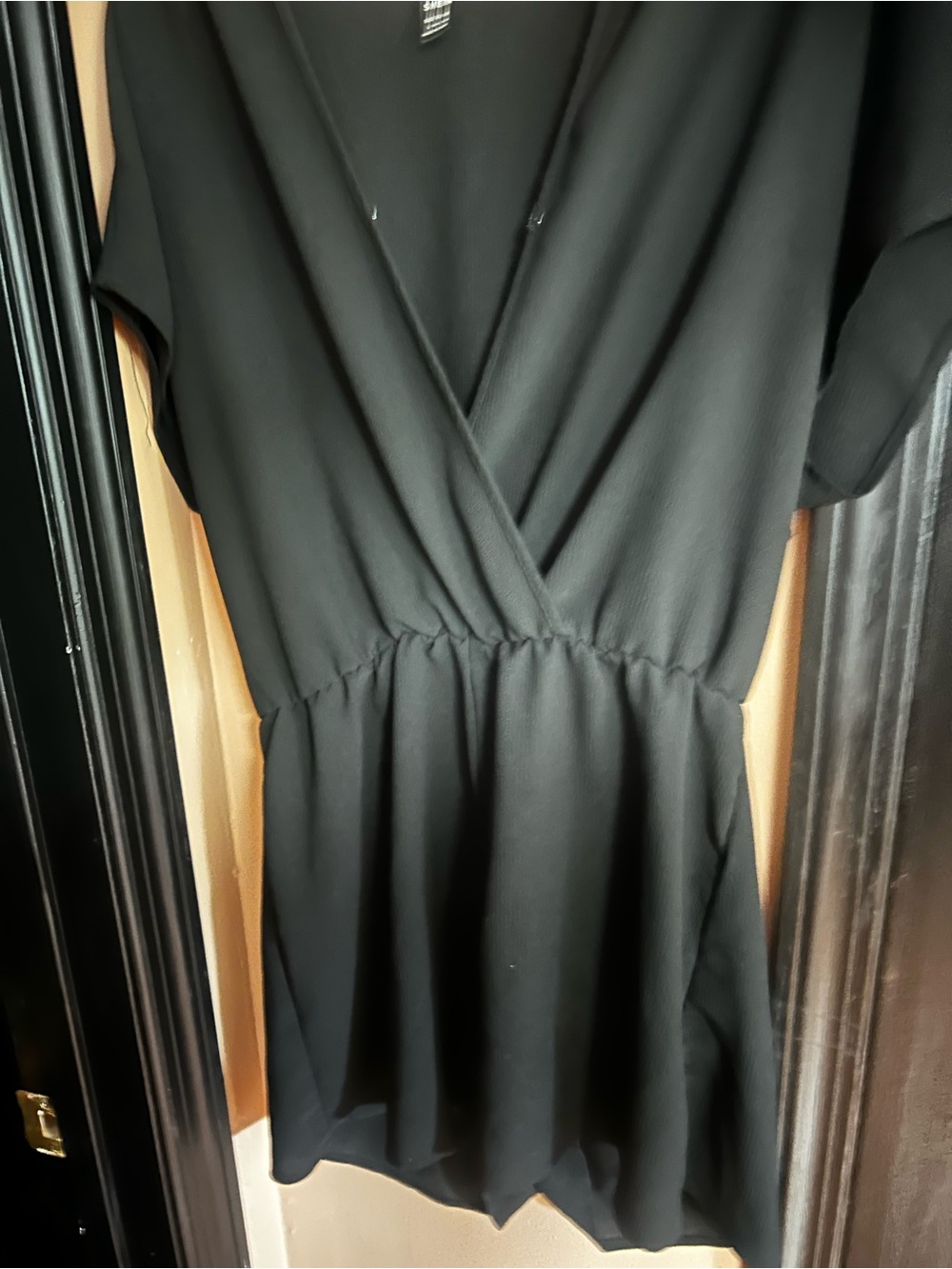 Used Womens size L- black Romper with snap closed button in front